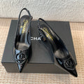 CHANEL MID-HEEL SLINGBACKS IN BLACK PATENT CALFSKIN